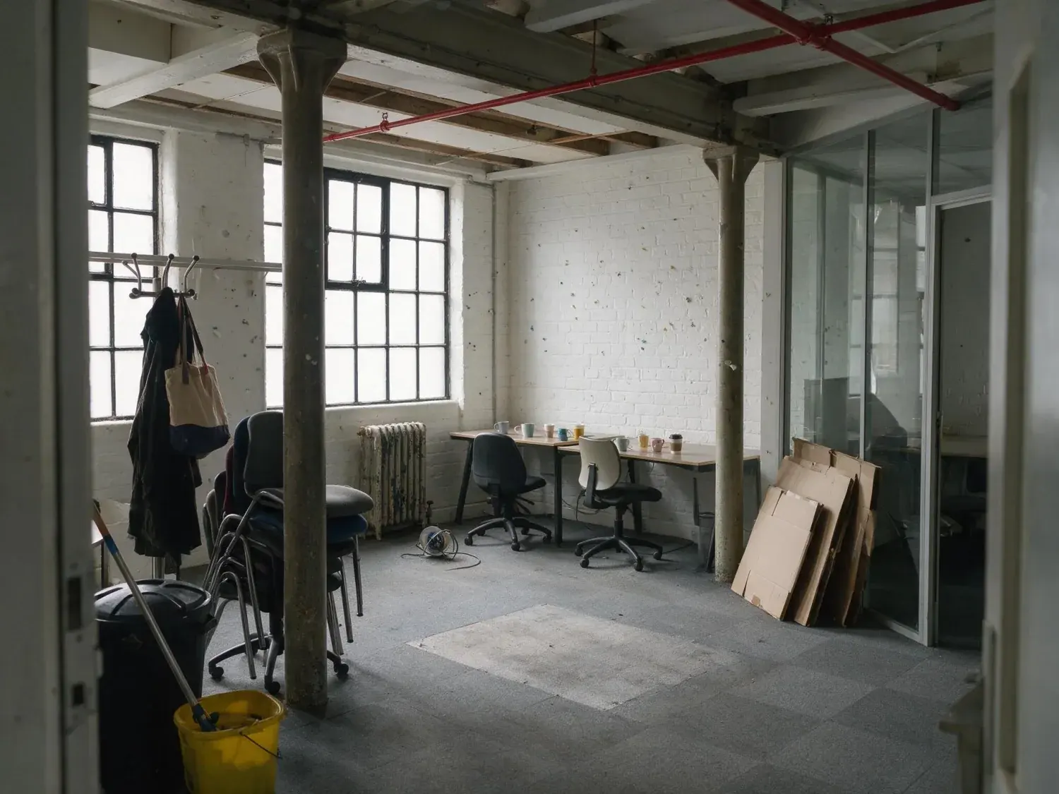 Before and after of a clerkenwell flex suite shot on hand-back day with the outgoing tenant's leftovers still standing in it — original listing photo before editing