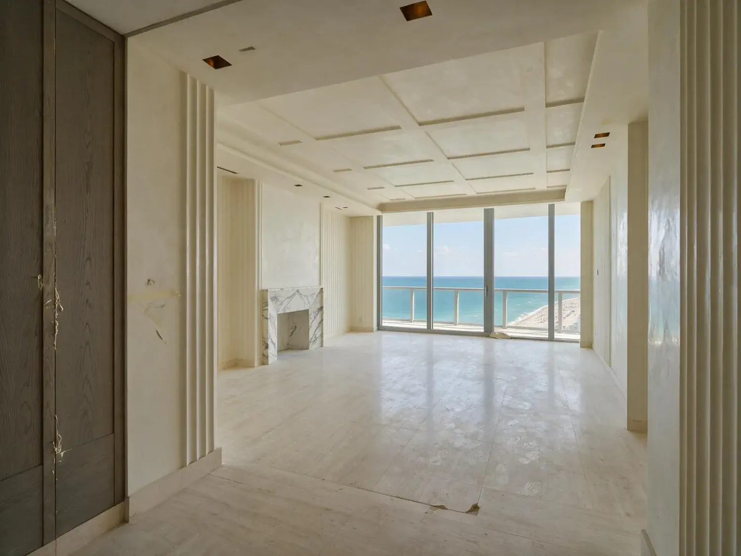 Before and after of an empty miami beach edition residences ocean-view condo is staged and finished as a branded-residence showcase, the existing atlantic kept pixel-for-pixel — original listing photo before editing