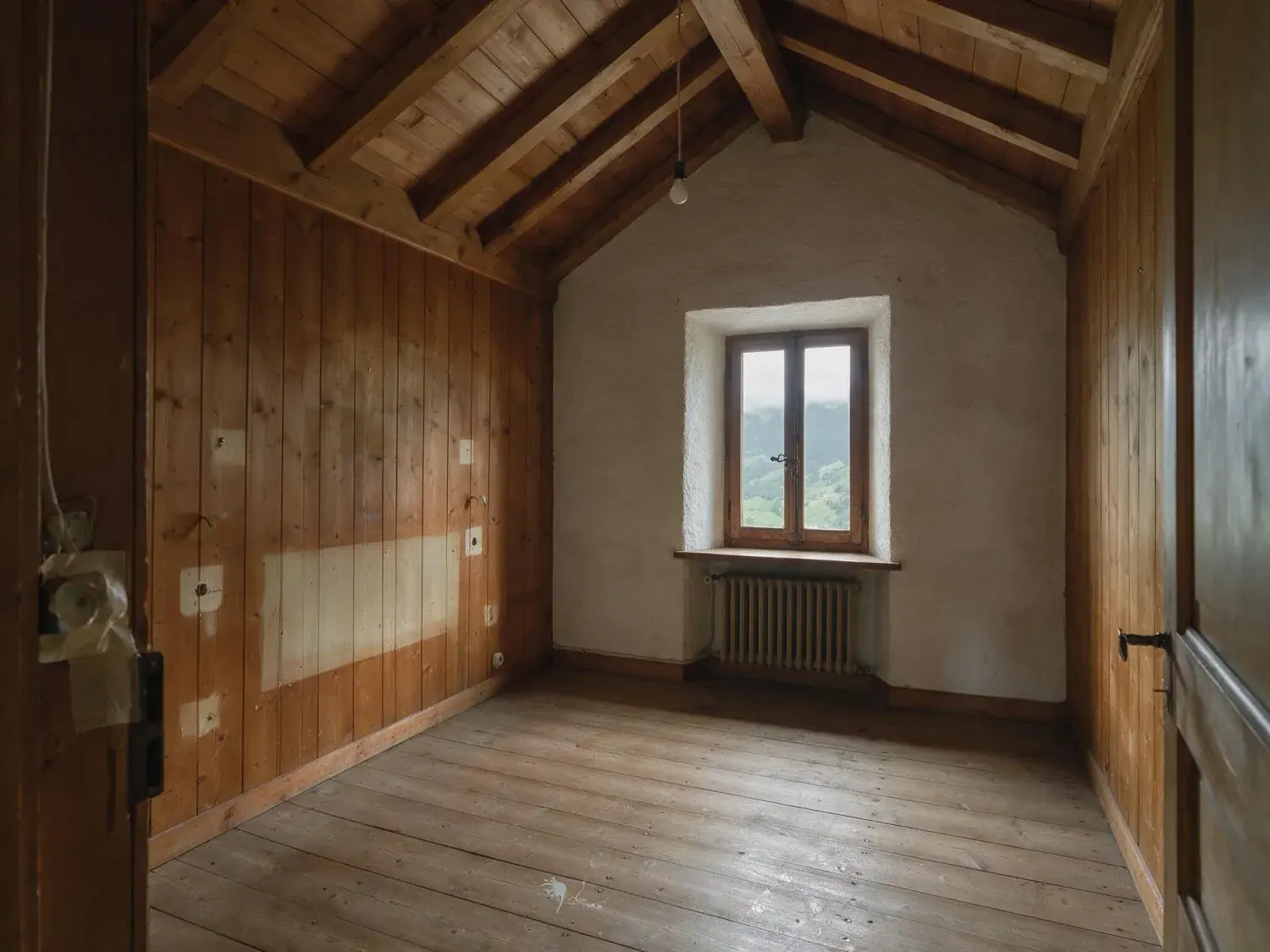 Before and after of a ski lodge guest bedroom emptied for the off-season refit, photographed before any furniture goes back into it — original listing photo before editing