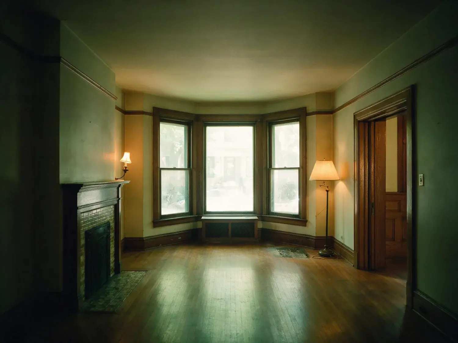 Before and after of a Lincoln Park greystone parlour, dark with the bay overexposed. — original listing photo before editing
