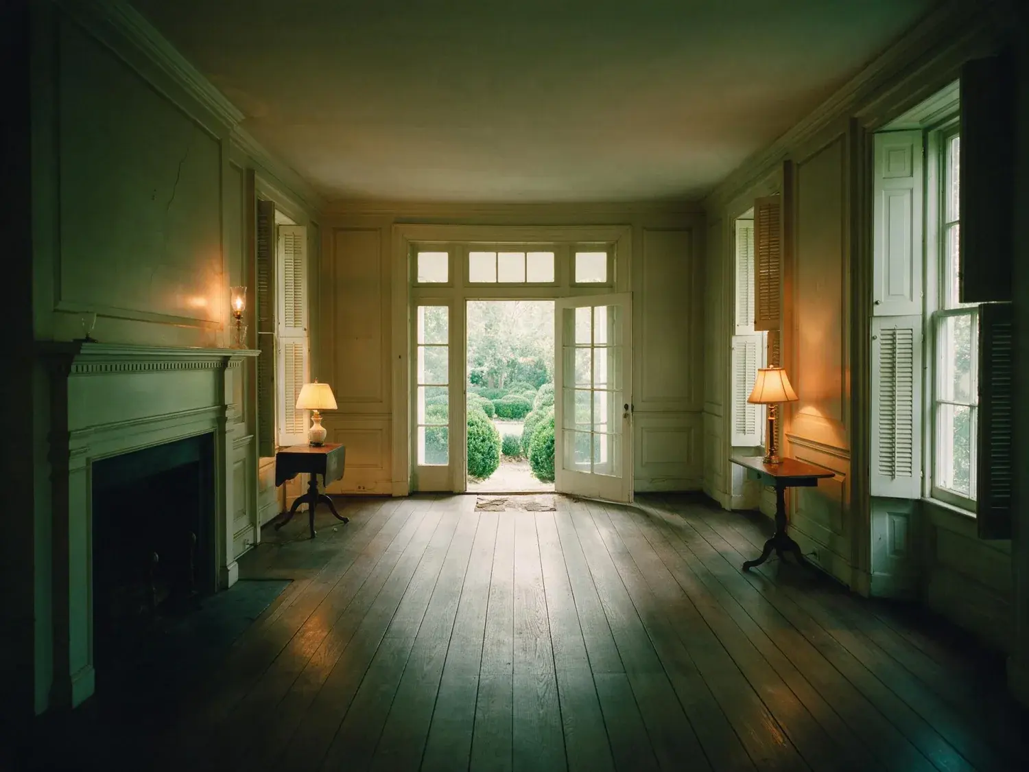 Before and after of a Belle Meade colonial room, flat and dim with the garden doors blown out. — original listing photo before editing