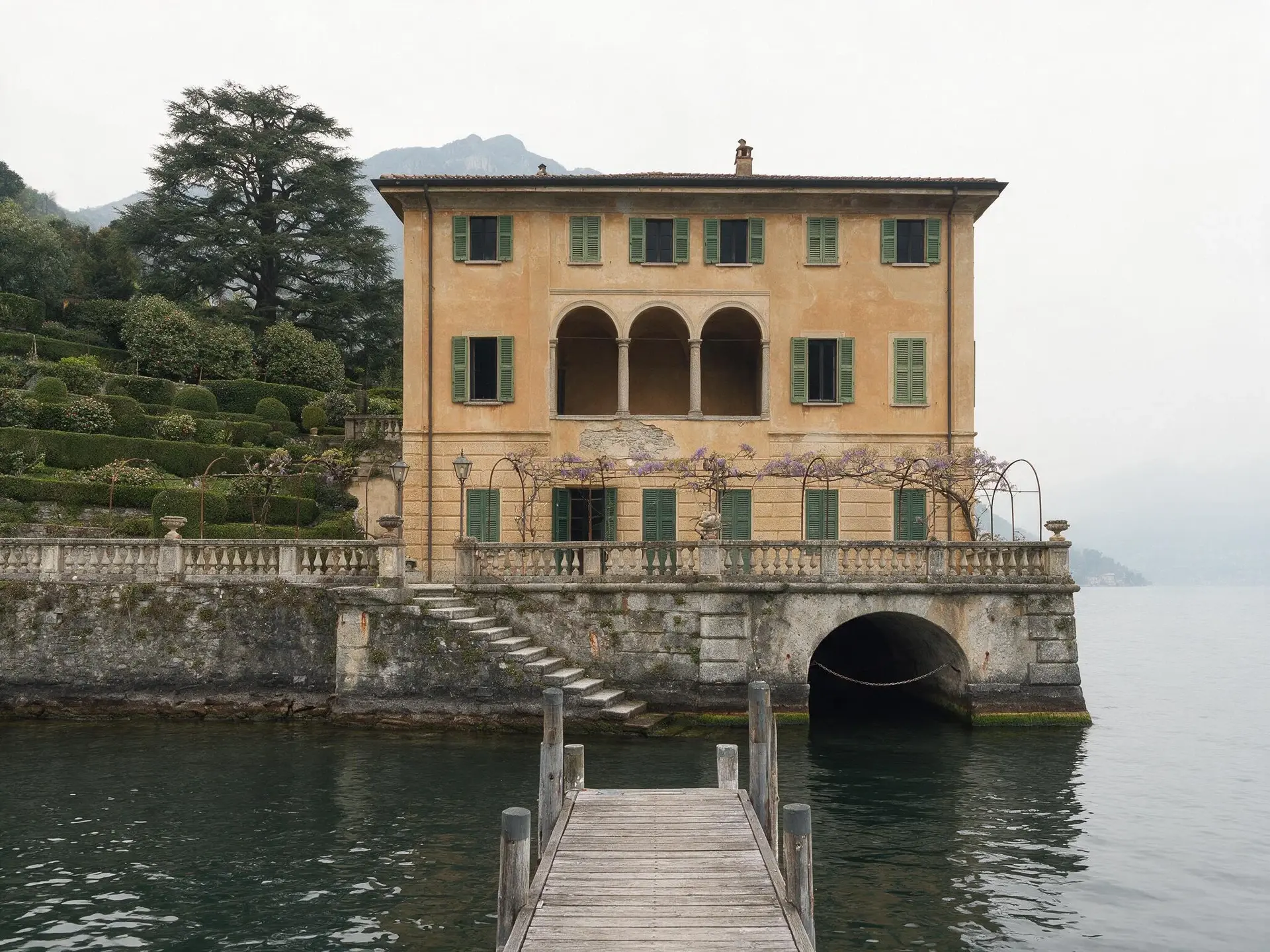 Before and after of a lakefront villa and boathouse at Bellagio, Lake Como, converted to golden-hour dusk. — original listing photo before editing