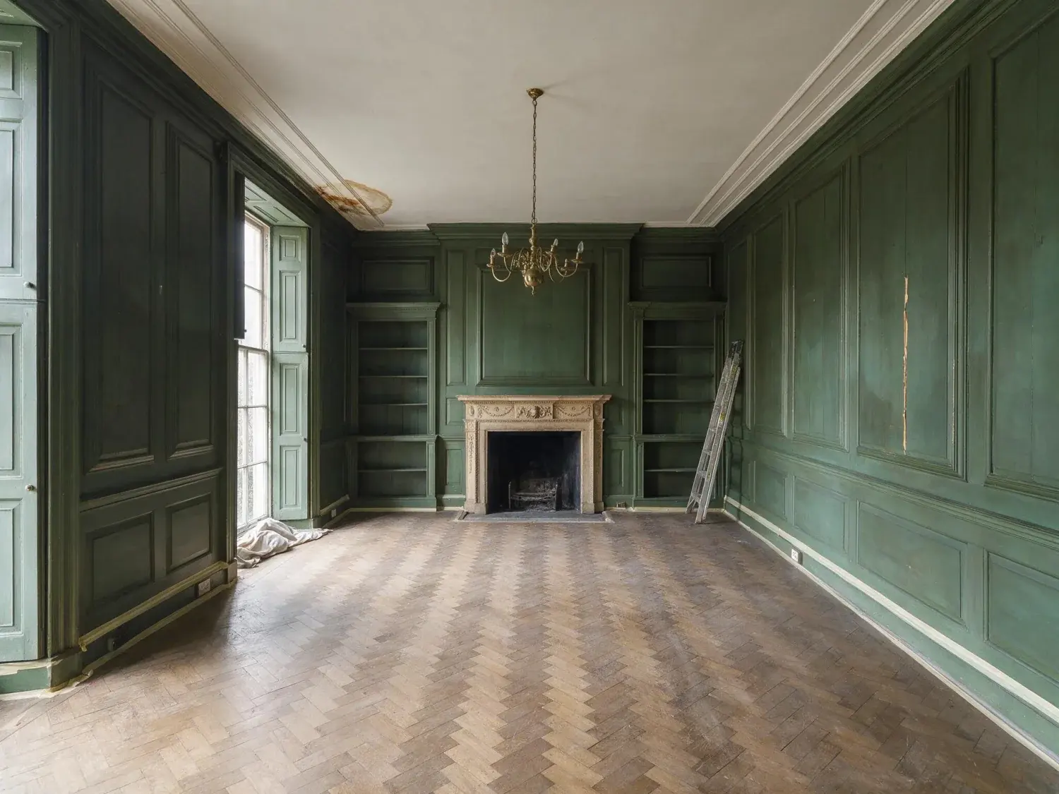 Before and after of an empty listed-townhouse library is staged into a clubland reading room, its panelled walls lined and its fire suddenly lit — original listing photo before editing