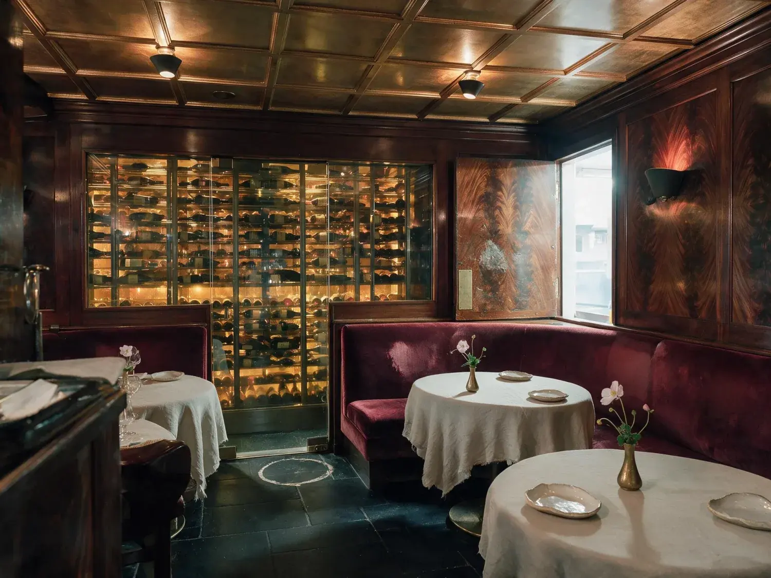 Before and after of a dark, intimate michelin-starred dining room recovers its velvet depth and glinting crystal without losing its secret-club shadow — enhanced by Plotpane