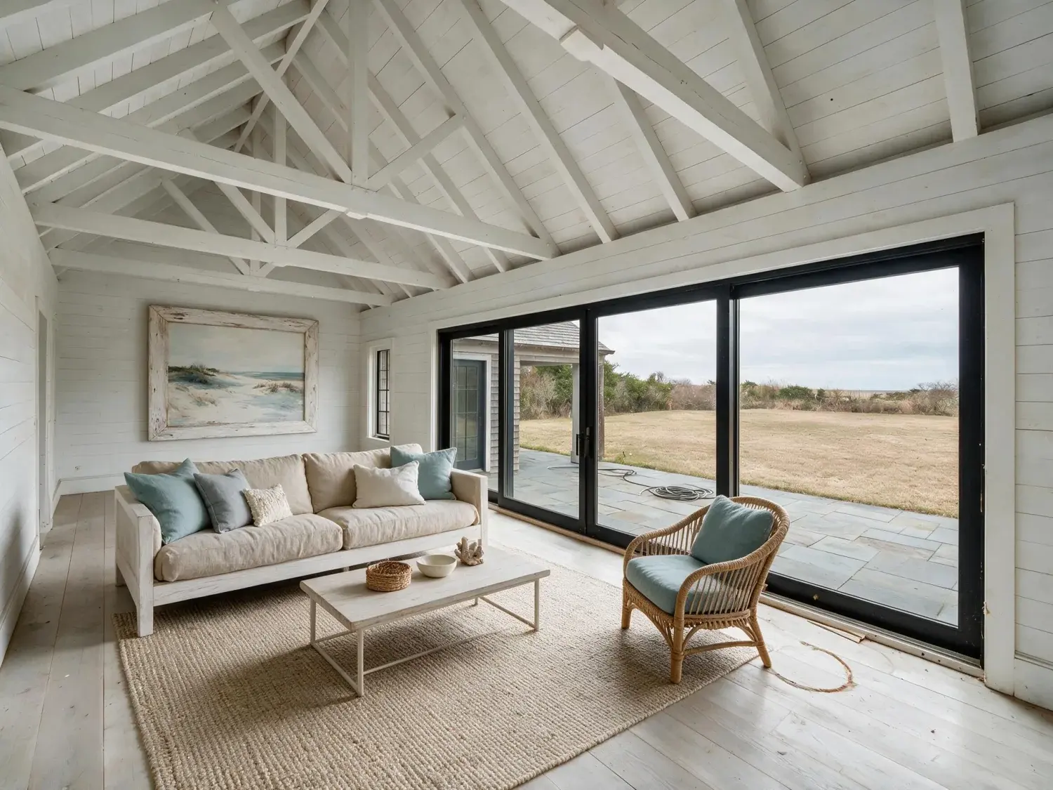 Before and after of a modern bridgehampton barn estate with a cathedral-height great room and sliding glass wall to bluestone patio, staged beyond single-purpose ai-staging tools — enhanced by Plotpane