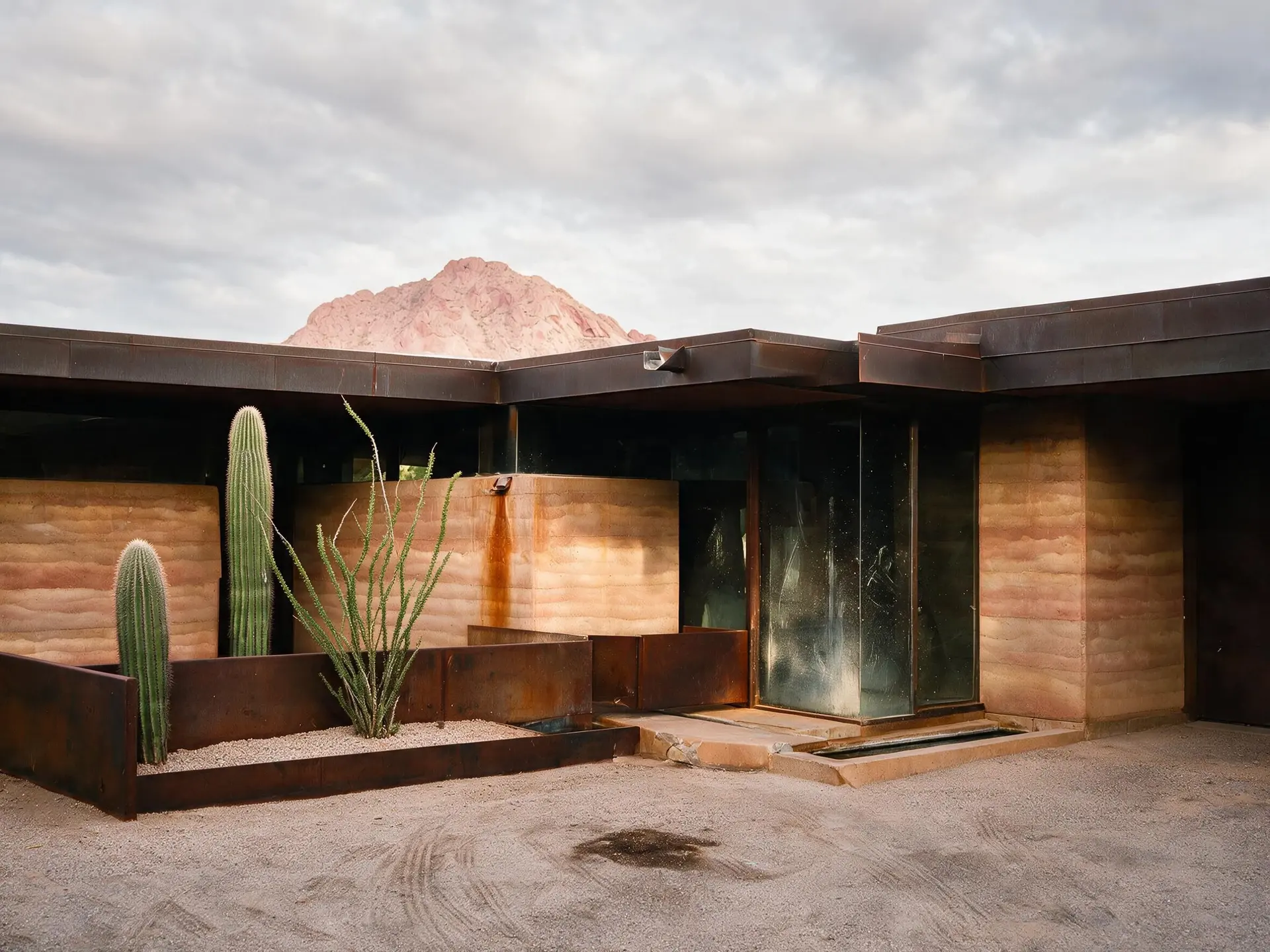 Before and after of a rammed-earth desert house below Camelback Mountain in Paradise Valley, Arizona. — enhanced by Plotpane
