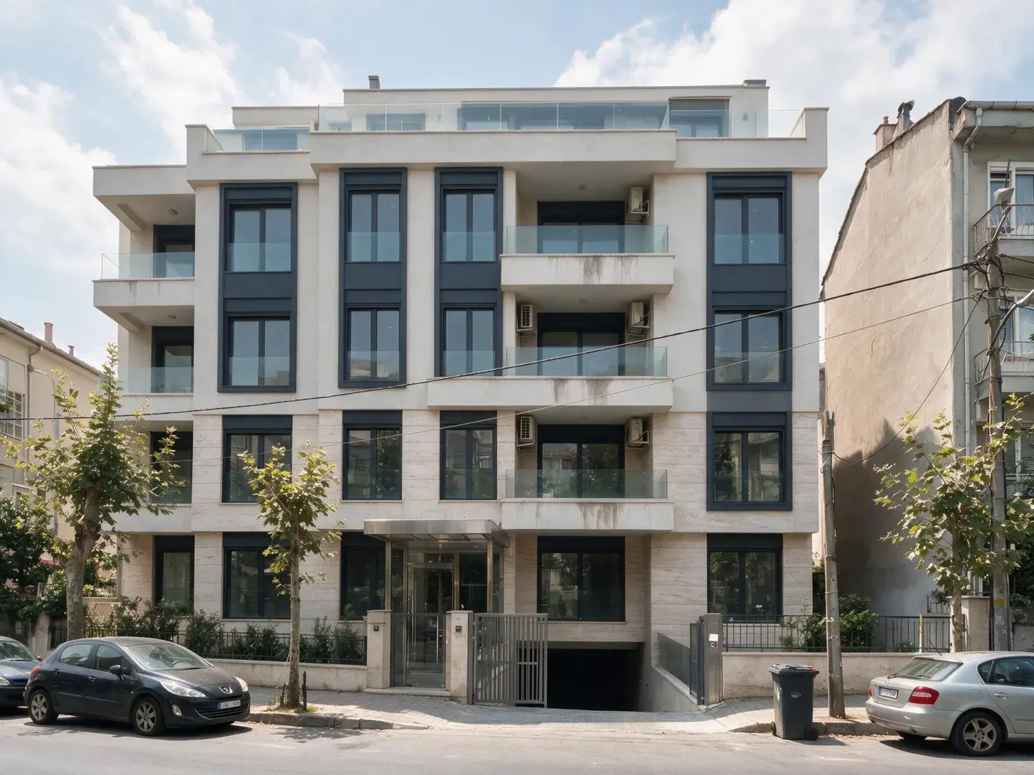 Before and after of a new bağdat caddesi kentsel dönüşüm block photographed under a blown-out white summer overcast — enhanced by Plotpane