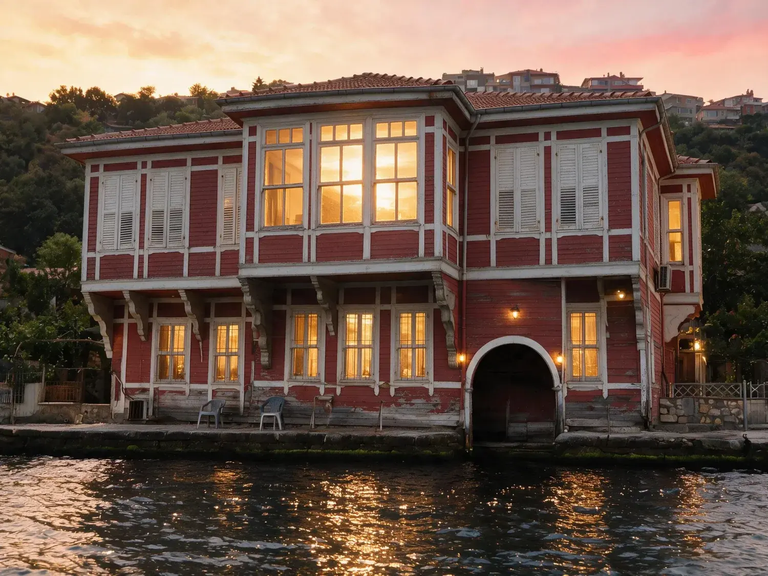 Before and after of a kanlıca yalı shot flat at midday from the water, with every window reading dark — enhanced by Plotpane