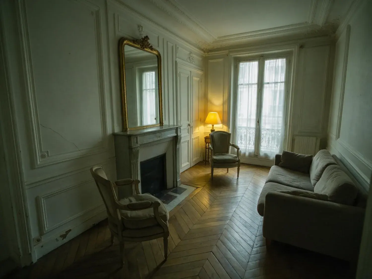 Before and after of a classic parisian salon with herringbone parquet and boiserie, lifted from murky underexposure to crisp editorial clarity — original listing photo before editing