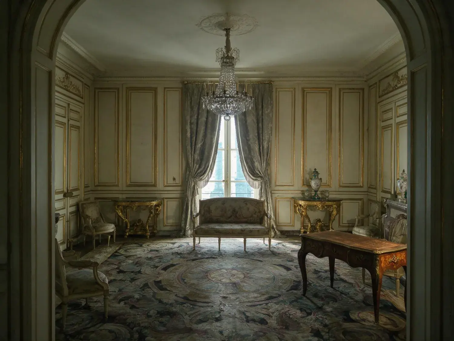 Before and after of the ritz paris suite impériale salon recovers its true gilded warmth — chandelier crystal, silk damask and savonnerie carpet — without losing its old-world restraint — original listing photo before editing