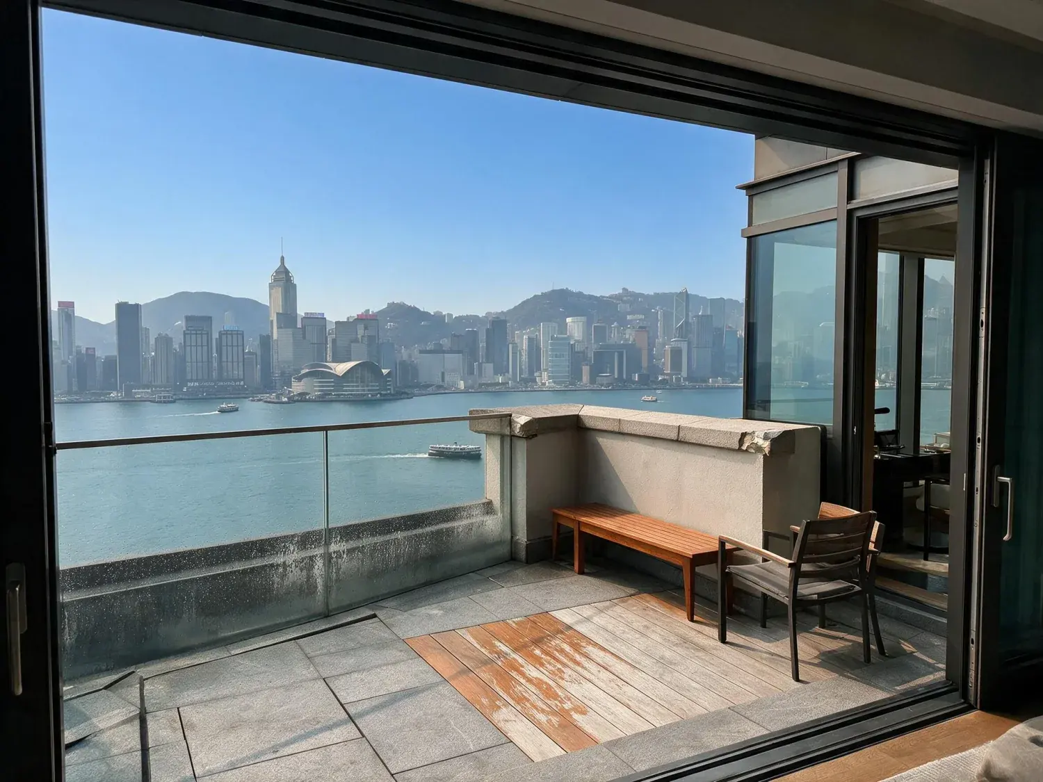 Before and after of a rosewood hong kong harbour suite window pivots from smog-grey oppressive haze to a clear, wind-scrubbed dusk over victoria harbour — enhanced by Plotpane