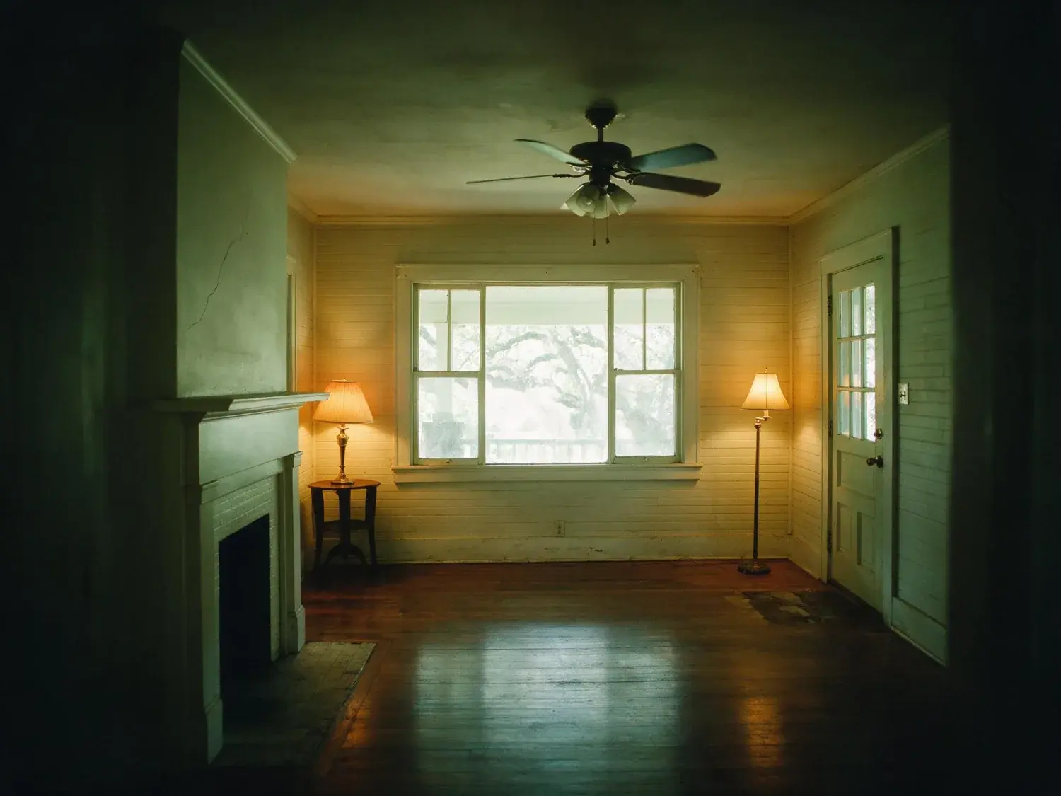 Before and after of a Clarksville bungalow, dim with the porch window overexposed. — original listing photo before editing