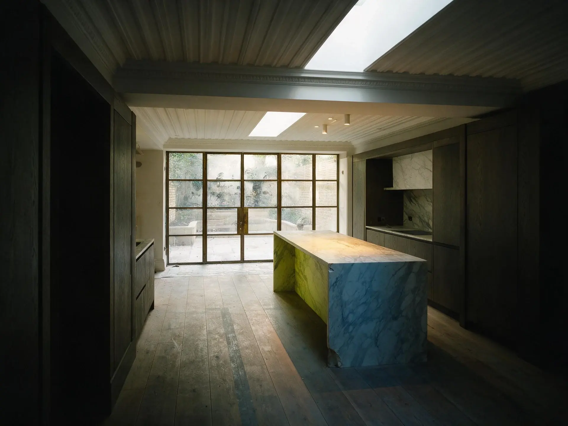 Before and after of a Belgravia garden-level kitchen in London corrected for exposure and colour. — original listing photo before editing