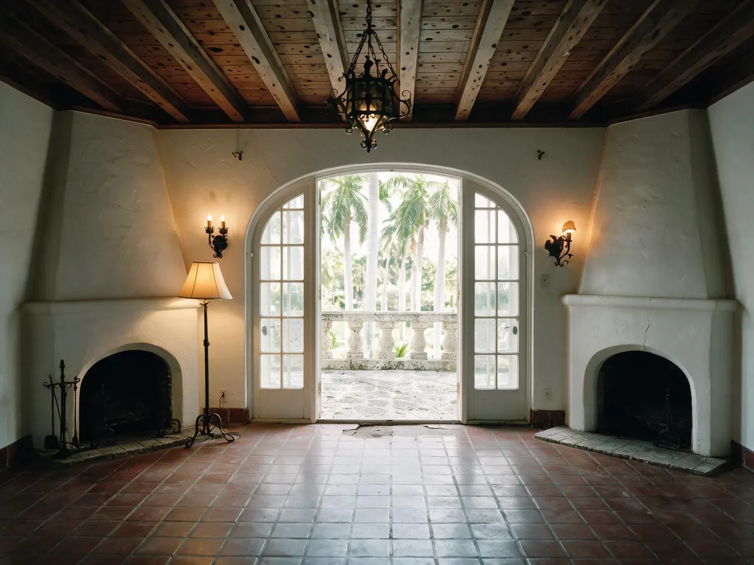 Before and after of a Coral Gables living room, dim with the arched openings burnt out. — enhanced by Plotpane