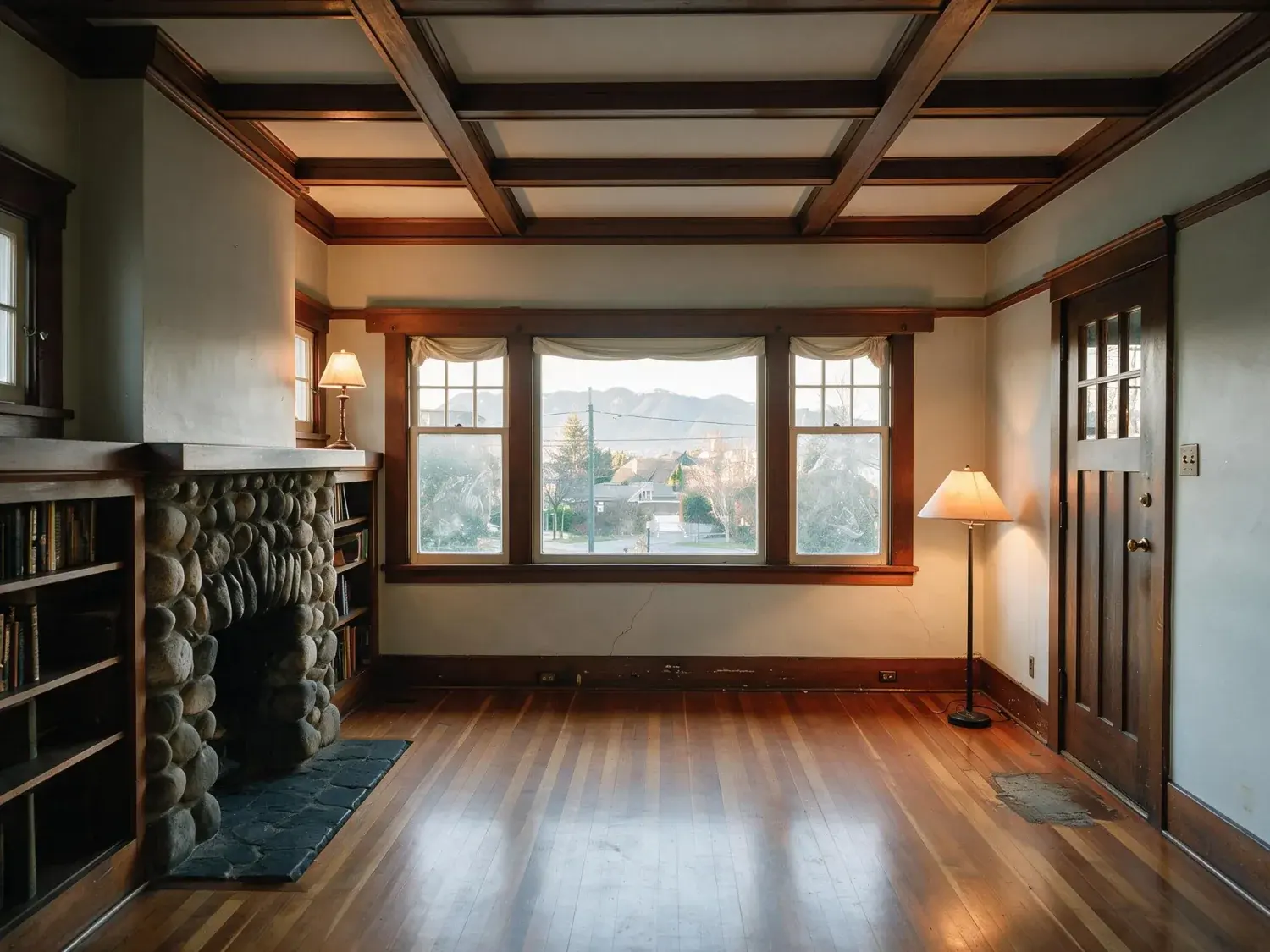 Before and after of a Kitsilano Craftsman room, flat and dim with the window burnt to white. — enhanced by Plotpane