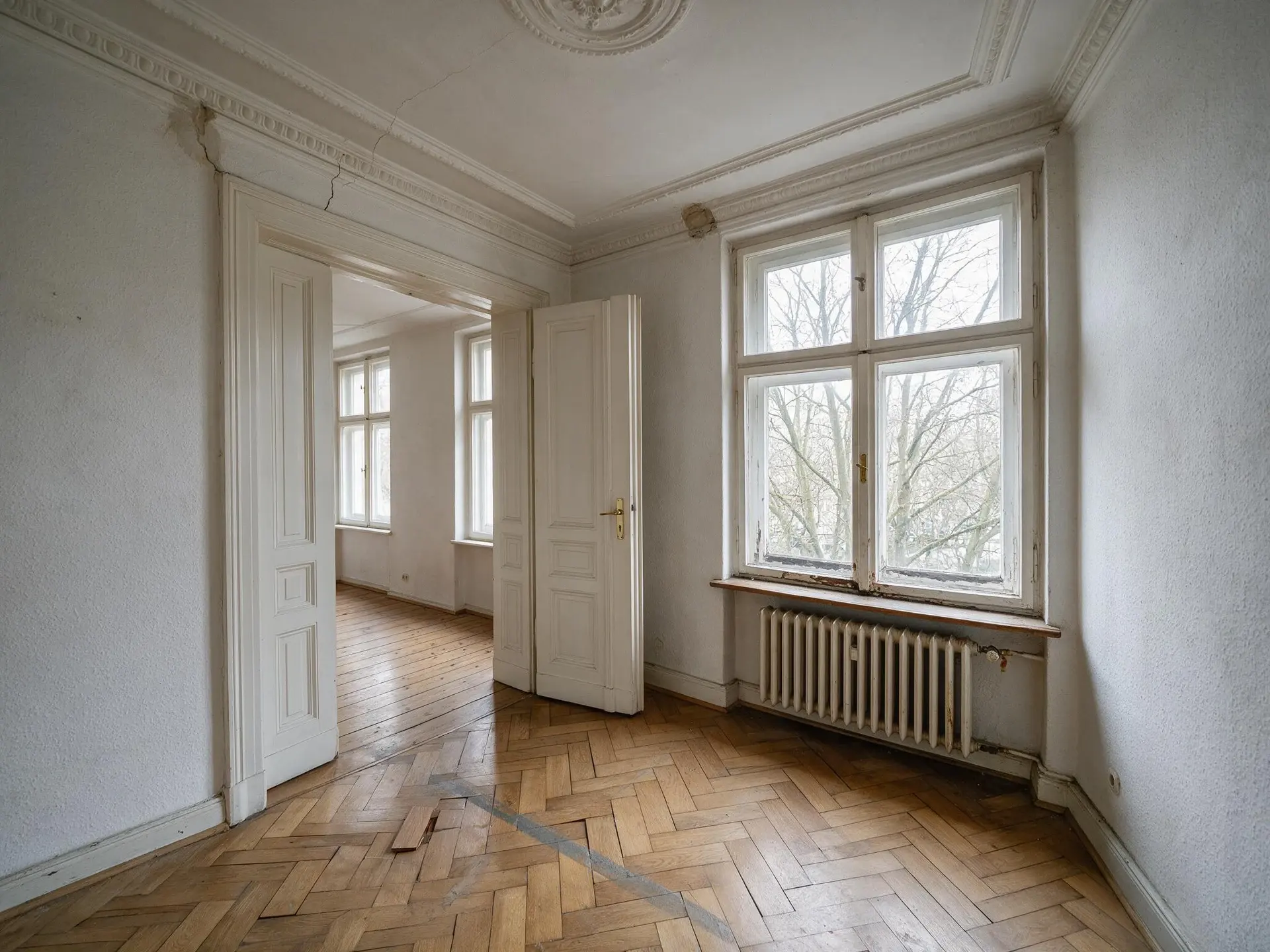 Before and after of a Gründerzeit Altbau reception room in Charlottenburg, Berlin, with leaning walls straightened. — original listing photo before editing