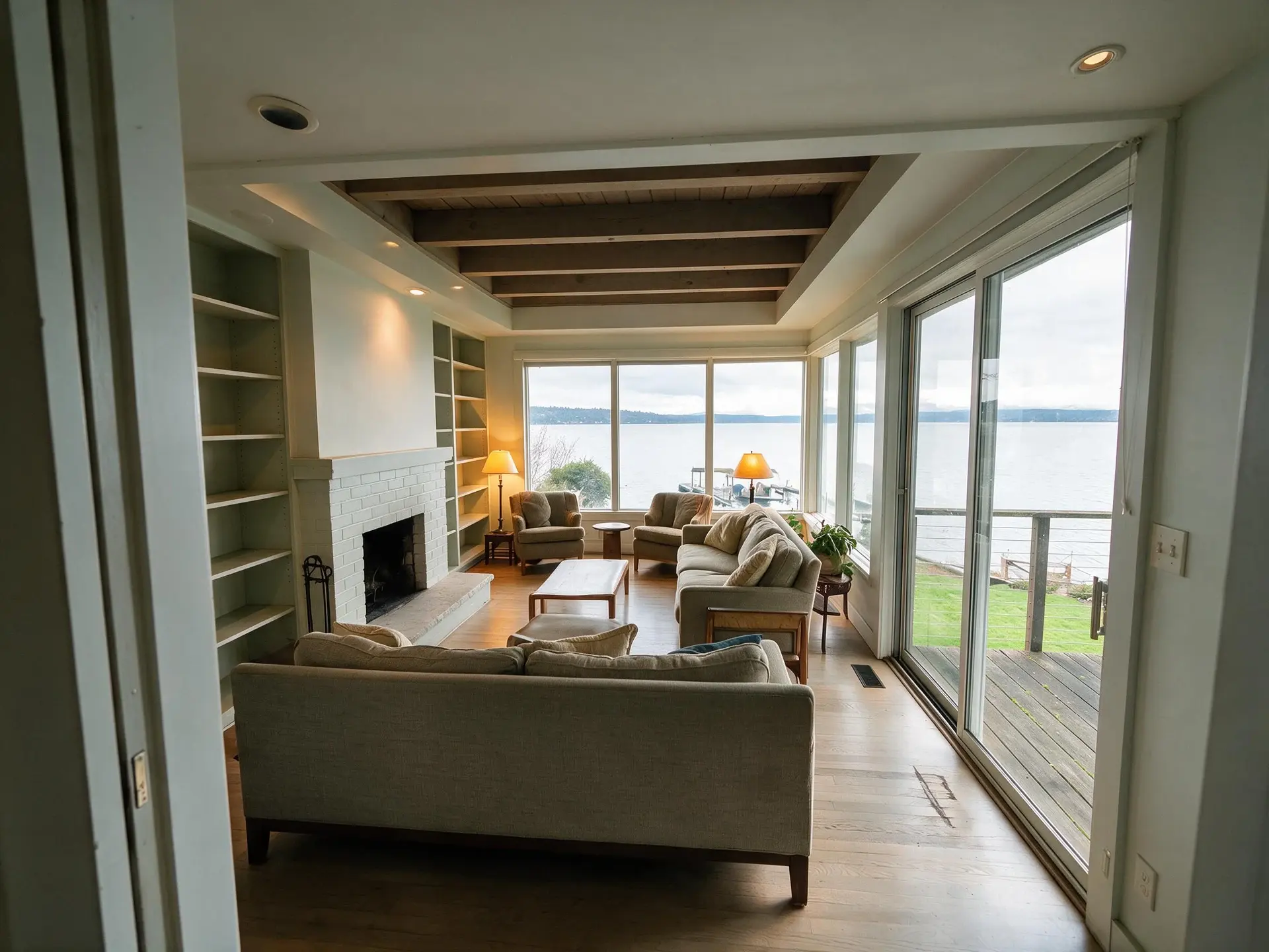 Before and after of a lakefront house living room in Madison Park, Seattle. — enhanced by Plotpane