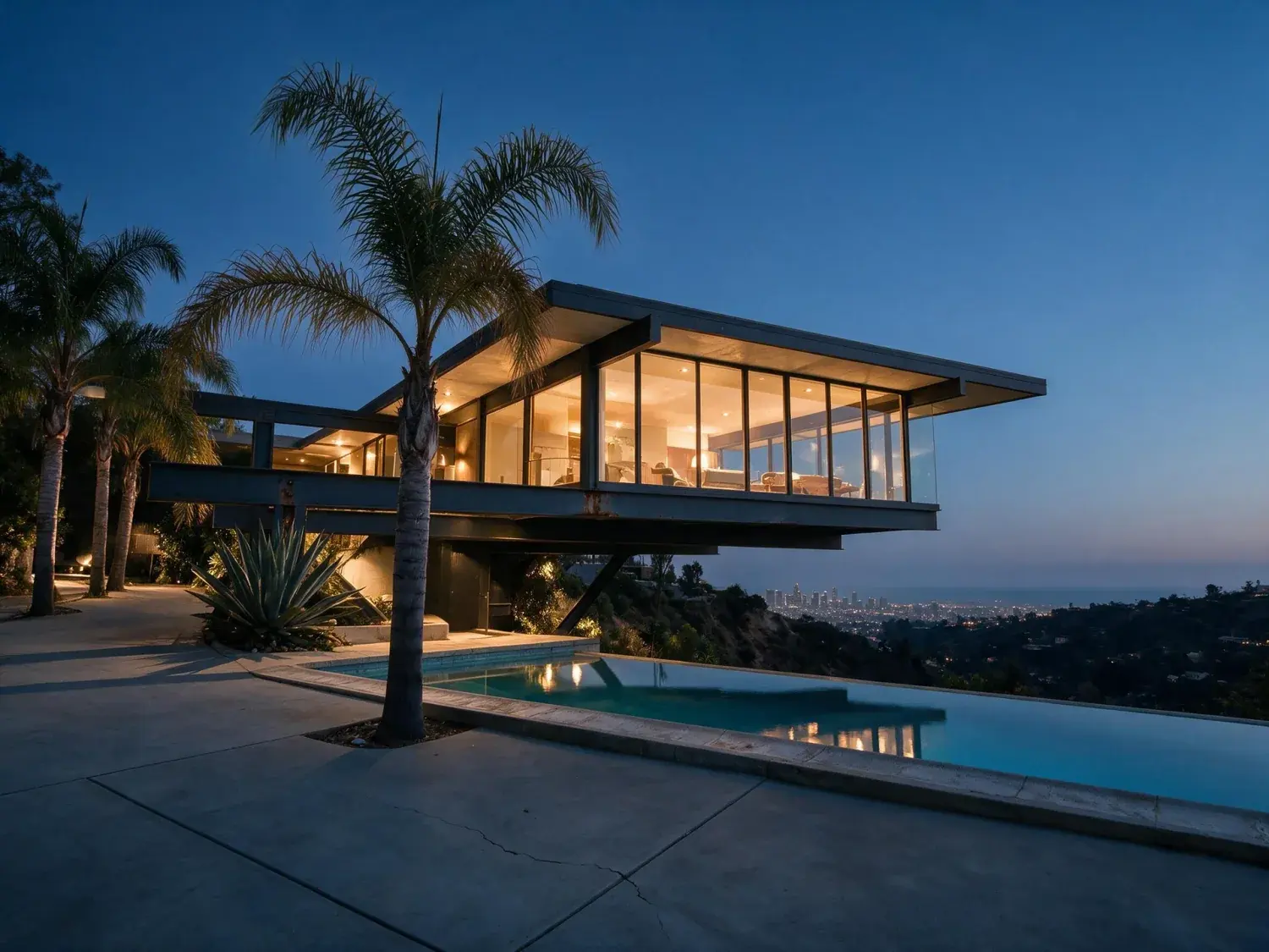 Before and after of a neutra-lineage steel-and-glass cantilever jutting over nichols canyon, transformed from flat midday glare to a cinematic la twilight with downtown skyline glinting beyond — enhanced by Plotpane