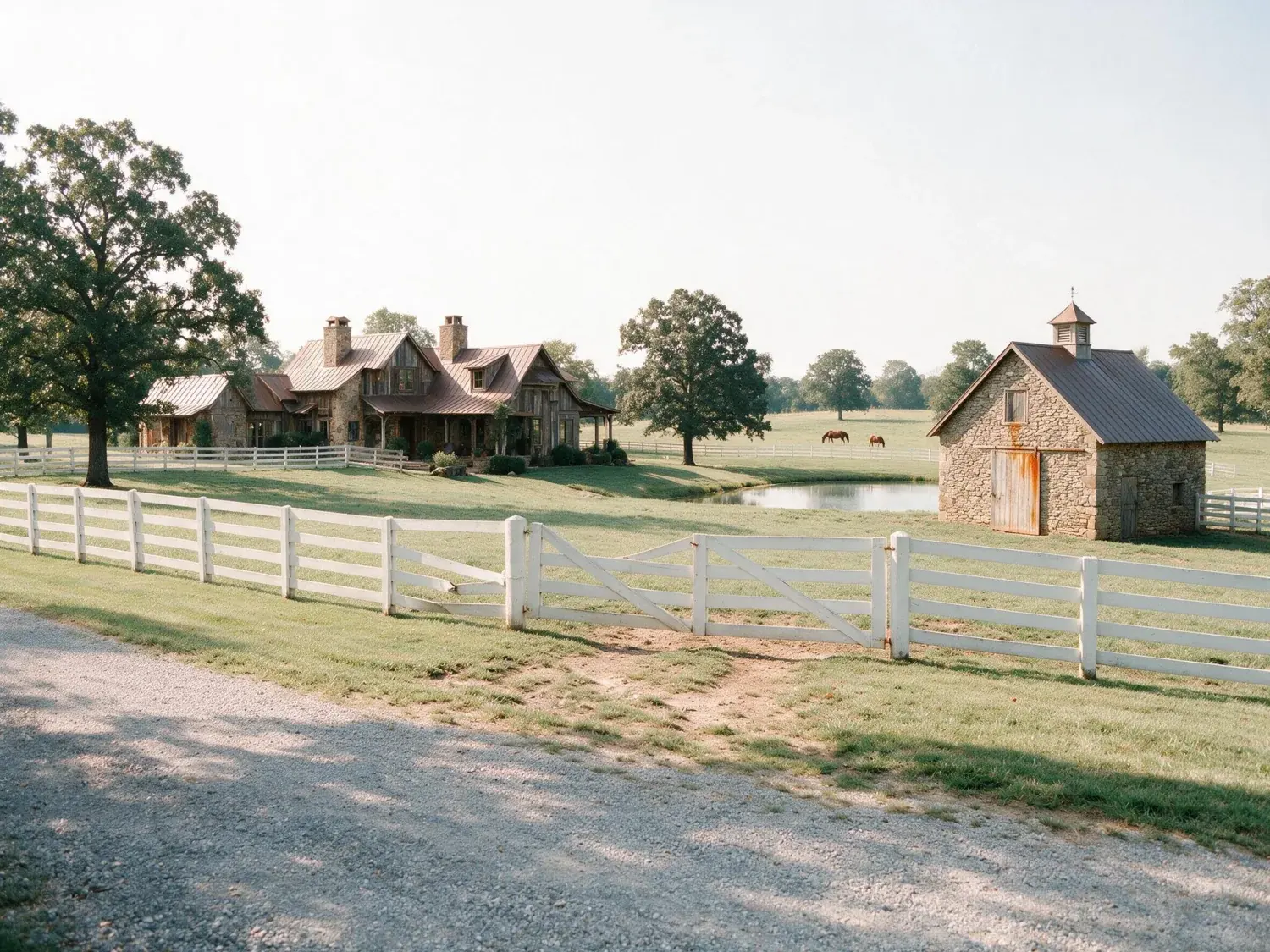 Before and after of a leiper's fork tennessee horse-country estate — rolling pasture, stone barn, bluestone springhouse — lifted from a flat phone shot into a sotheby's-register editorial hero — enhanced by Plotpane