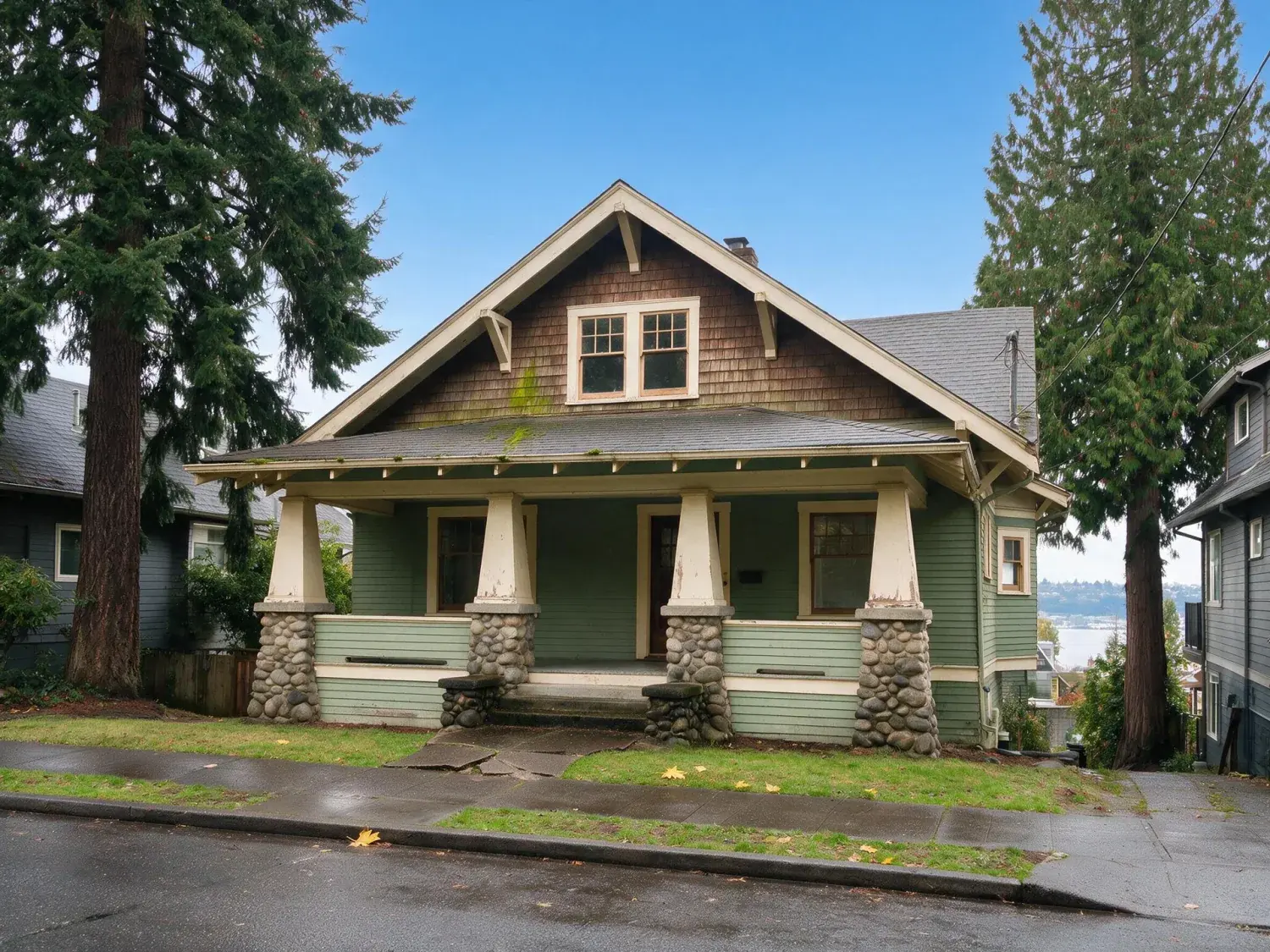 Before and after of a 1912 capitol hill craftsman with deep eaves and a lake union view, rescued from seattle's flat grey sky into a crisp rainier-visible pnw clear-day frame — enhanced by Plotpane
