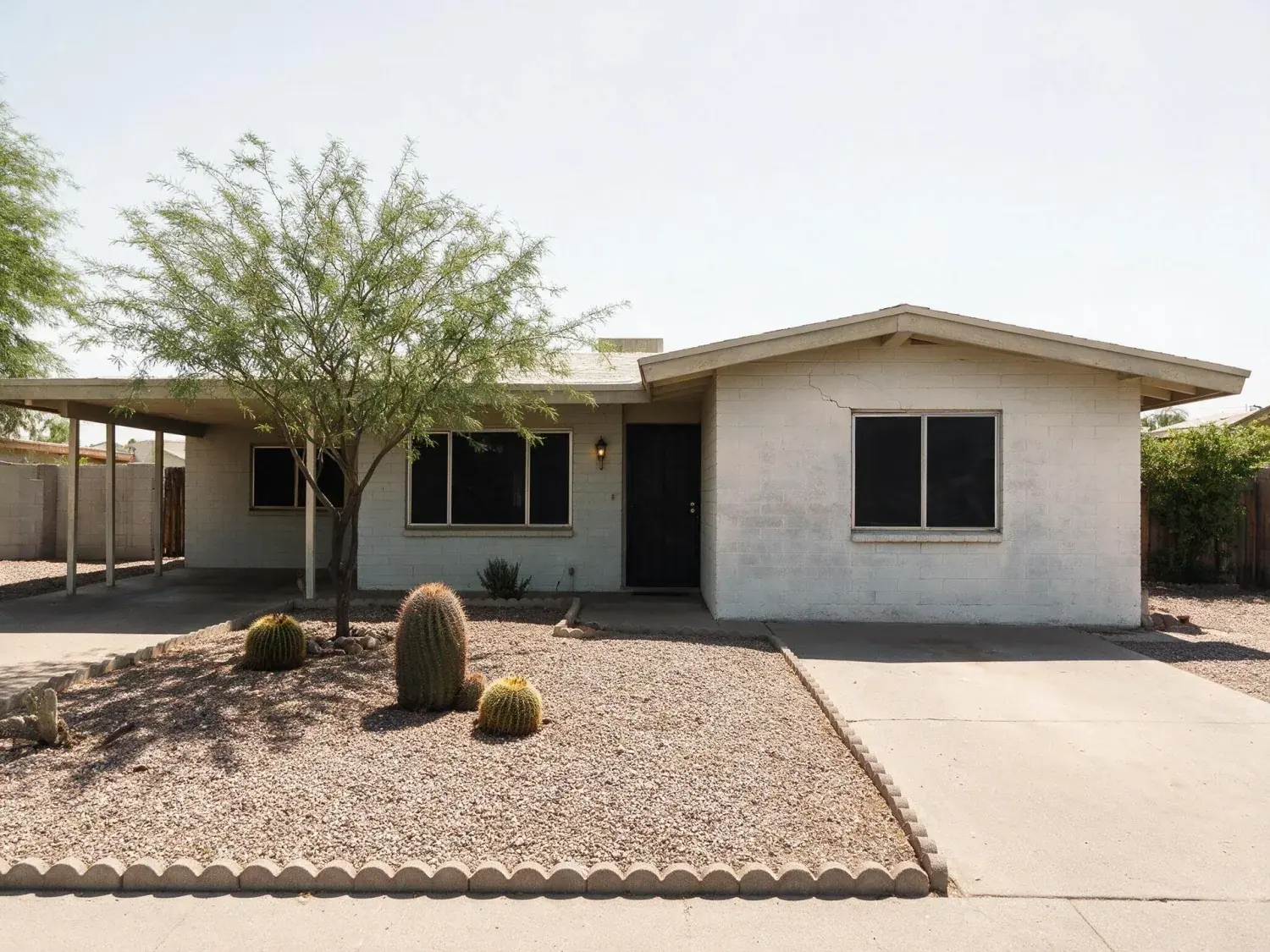Before and after of a phoenix ranch front elevation shot at eleven in the morning in june, when the light is at its worst — original listing photo before editing