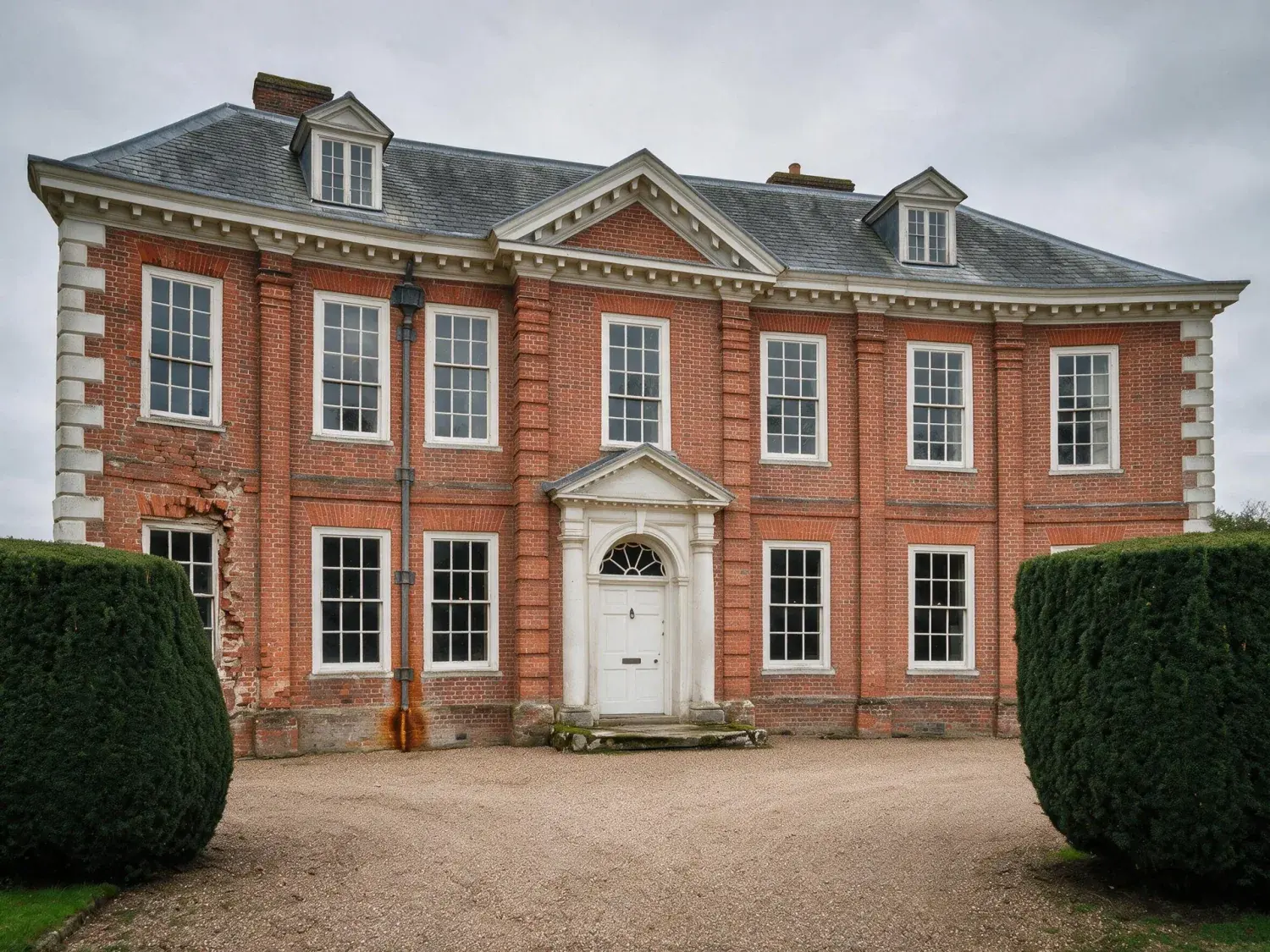 Before and after of a five-bay georgian manor, its classical symmetry restored after a careless handheld tilt flattened its grandeur — enhanced by Plotpane