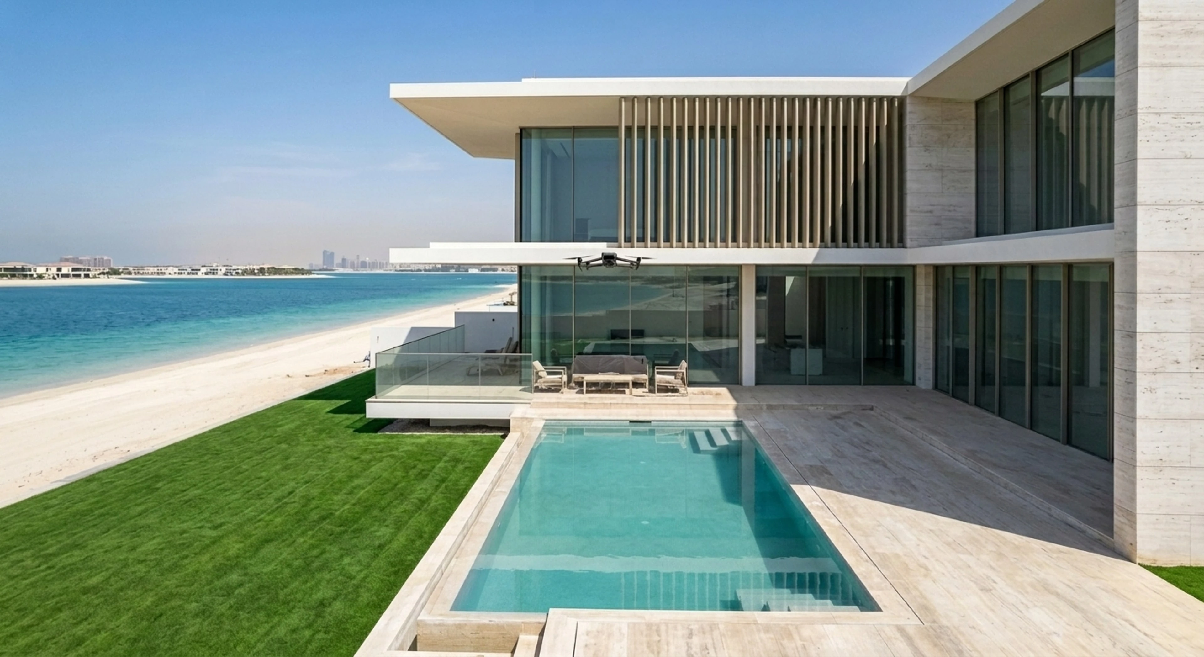 A contemporary white villa on the tip of a Palm Jebel Ali frond, its infinity pool meeting the Arabian Gulf in a single seamless plane. — enhanced by Plotpane