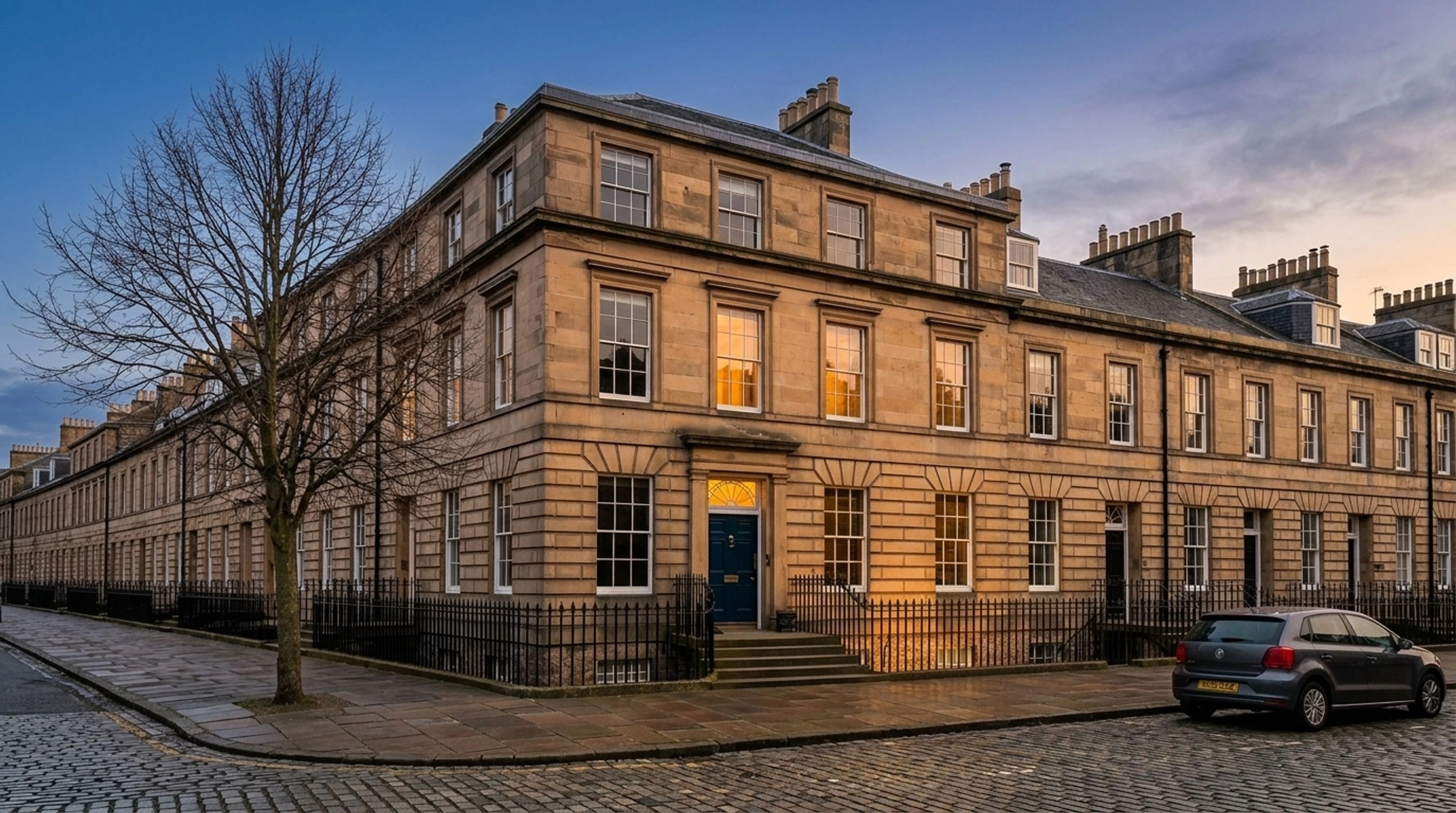 A north-facing Craigleith-sandstone Georgian terrace in Edinburgh's New Town, captured flat and grey, relit to civil twilight. — enhanced by Plotpane