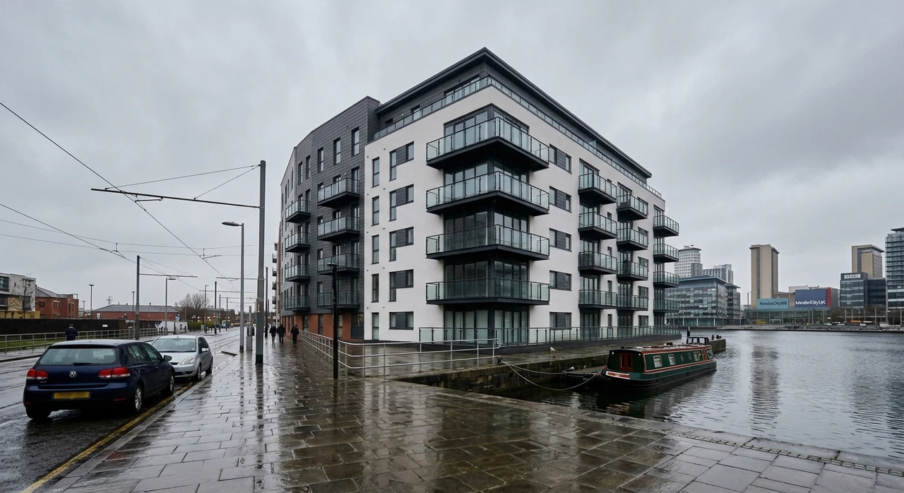A Salford Quays waterfront modernist apartment block captured under flat Pennine overcast — recovered into a Rightmove premium hero. — original listing photo before editing