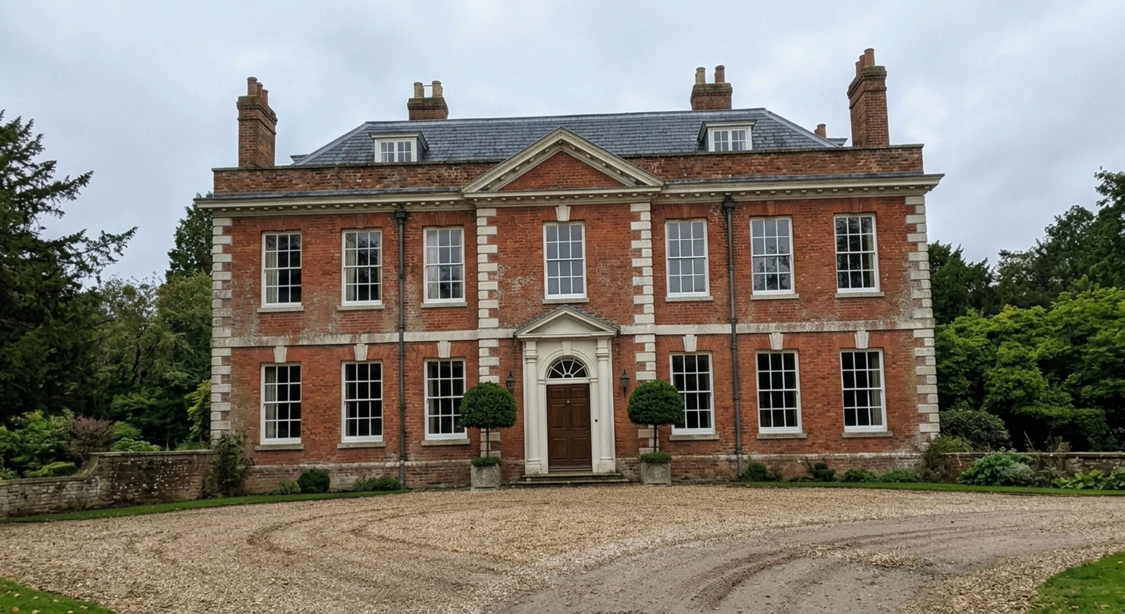 A five-bay Georgian manor, its classical symmetry restored after a careless handheld tilt flattened its grandeur. — enhanced by Plotpane